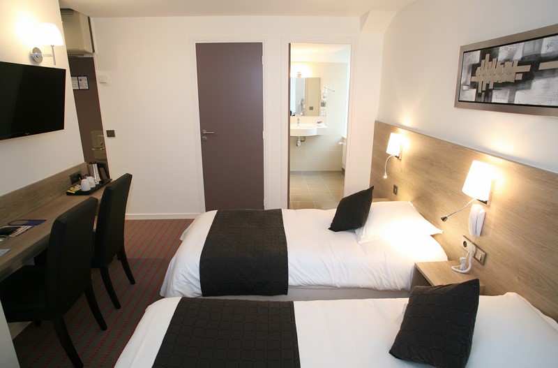 Une chambre de l'Hôtel Le Louvre à Cherbourg